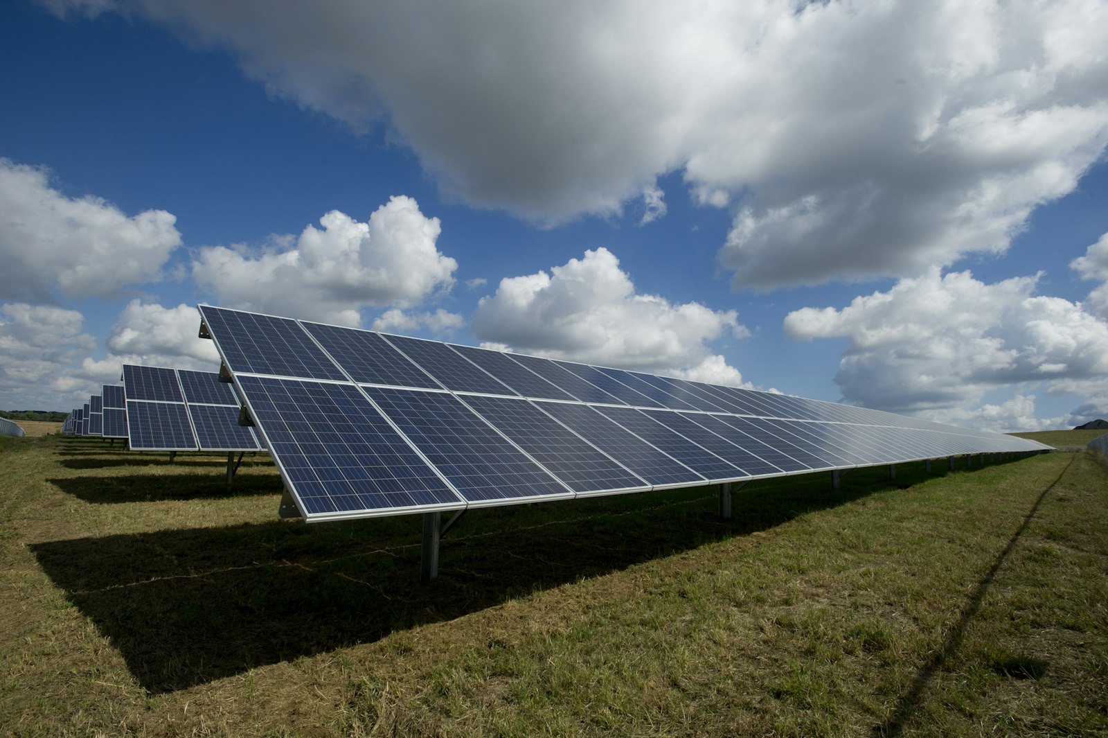 Solar panels and mountains in the rural landscape of Spain at sunrise
